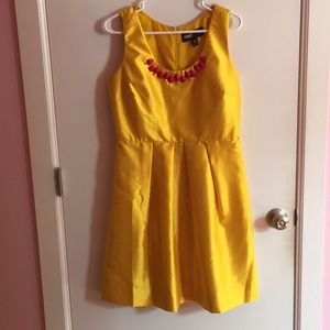 Shiny Yellow Dress with Pink Beaded Collar